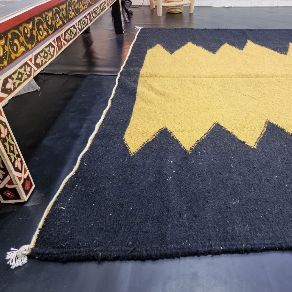 Black and yellow Berber kilim rug