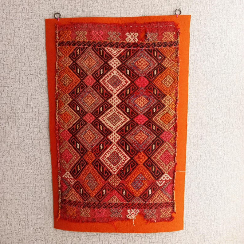 kilim rug on wall
