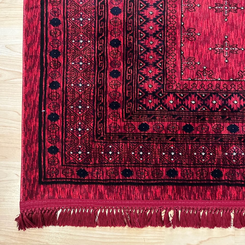 Red afghan style printed rug